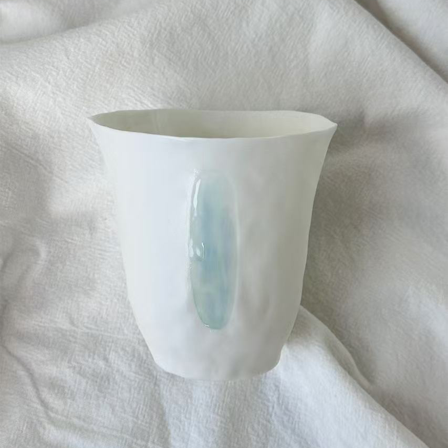 Jiayu · Flowing Eternity · Hand-Pinched White Porcelain Cup